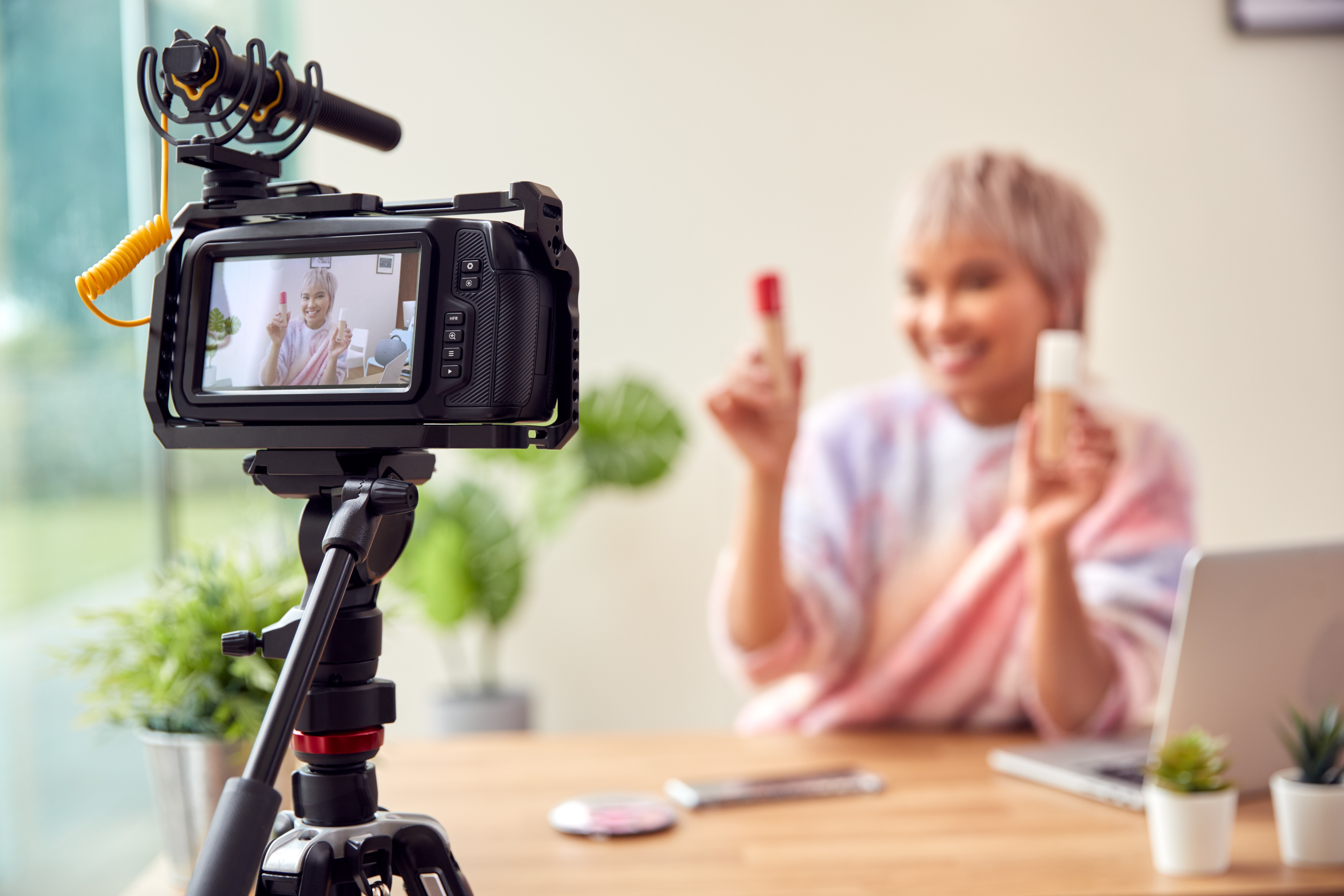 a person recording a vlog using her camera