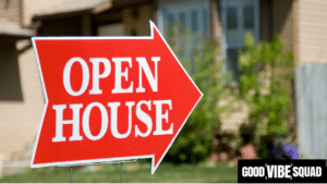 red open house sign in a green yard to symbolize the question, "what do loan officers do at open houses?"