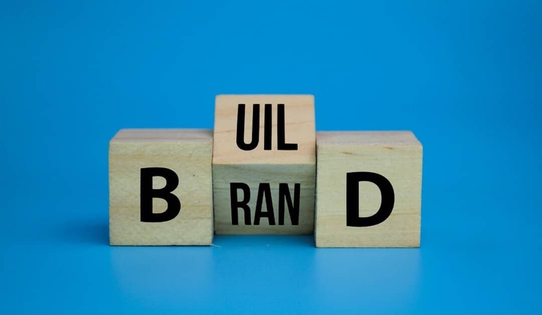 Wooden cube with the word build your brand symbol